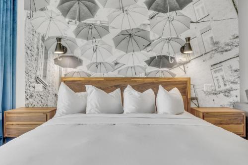 Ένα ή περισσότερα κρεβάτια σε δωμάτιο στο INITIAL - DISTRICT - Centre-Ville de Québec