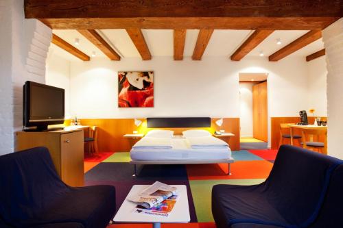 Ein Bett oder Betten in einem Zimmer der Unterkunft Hotel am Havelufer Potsdam
