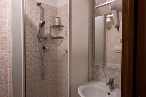 a bathroom with a shower and a sink at Antica Raffineria in Venice