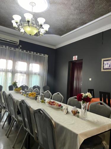 a conference room with a long table and chairs at TRMOTEL in Matola