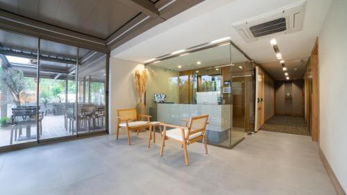 a dining room with a table and chairs at Bomo Suites in Antalya