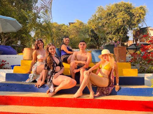 a group of women sitting on some steps at Green Door San Gil in San Gil