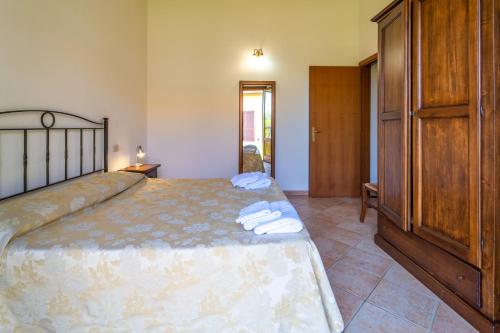 Postel nebo postele na pokoji v ubytování Agriturismo il Tripesce