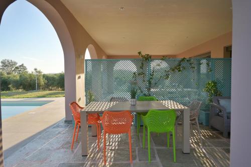 a table and chairs sitting on a patio at Antinea Olympian Villa in Olympia
