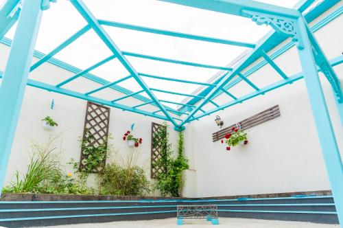a greenhouse with plants on the wall at Babilon in Sarichioi