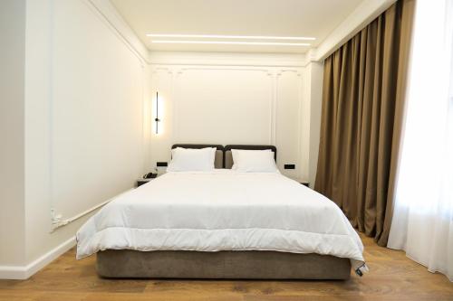 Postel nebo postele na pokoji v ubytování Hotel Adore