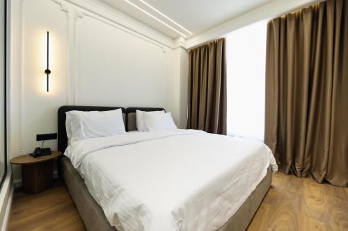 Postel nebo postele na pokoji v ubytování Hotel Adore