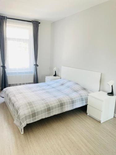 Postel nebo postele na pokoji v ubytování JANO apartment Klaipėda City Center