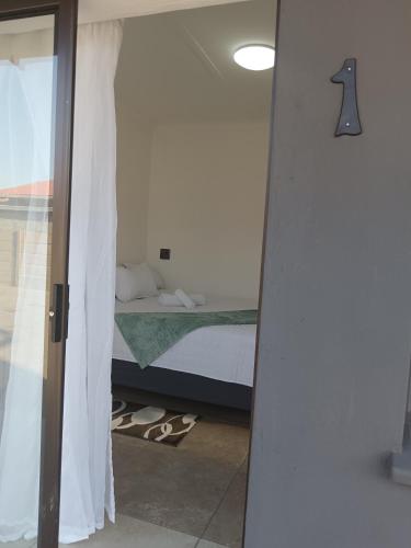 Postel nebo postele na pokoji v ubytování Peacefull Haven