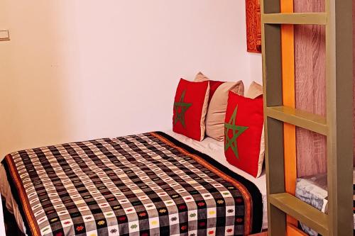 a bedroom with a bunk bed next to a ladder at SULTANA Beach Riad in Saidia 