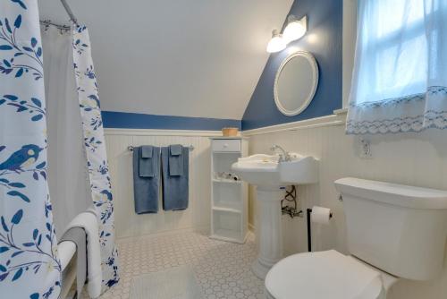 a small bathroom with a toilet and a sink at James Place Inn Bed and Breakfast in Freeport