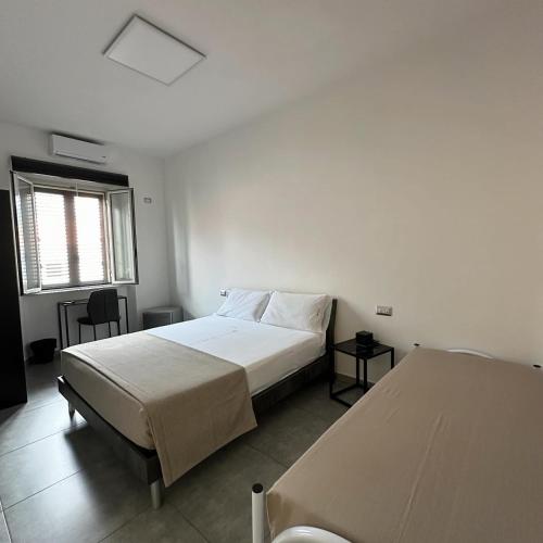 Una cama o camas en una habitación de Grenada Home