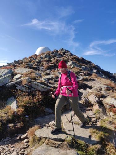 a woman is standing on a rocky mountain at Ferienhaus Koglegg in Wies