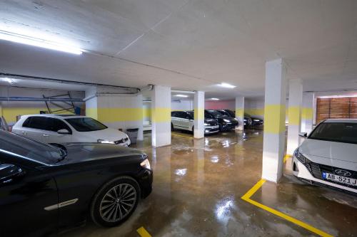 a parking lot with several cars parked in it at Hotel Mira Mare in Ksamil