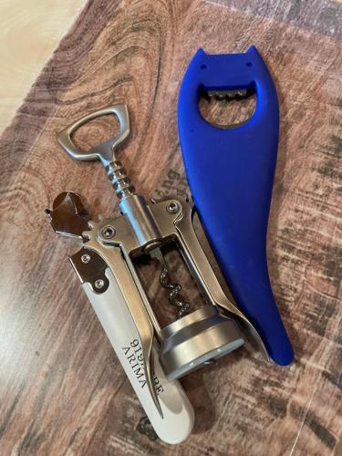a pair of scissors on top of a wooden table at 919神戸有馬 一棟貸切ログハウスMax6名1日1組限定 in Kobe