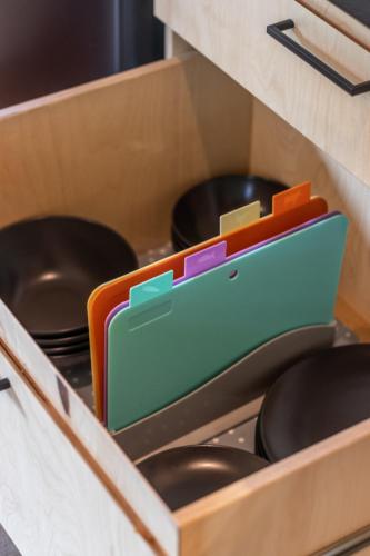 a wooden drawer filled with pots and pans at Jaunjespari 1 in Batciems