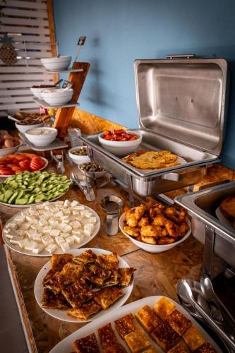 a buffet with many different types of food on a table at Hotel Ajden by Mira Mare in Ksamil