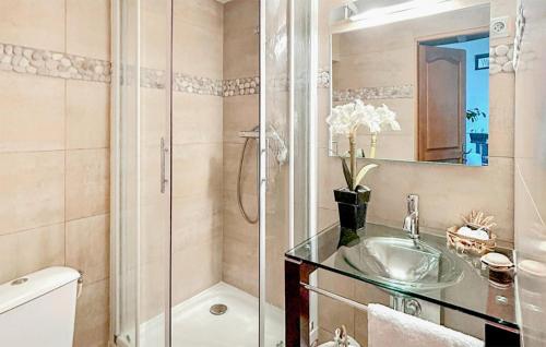 a bathroom with a shower and a sink and a toilet at 5 Bedroom Beautiful Home In Fauverney in Fauverney