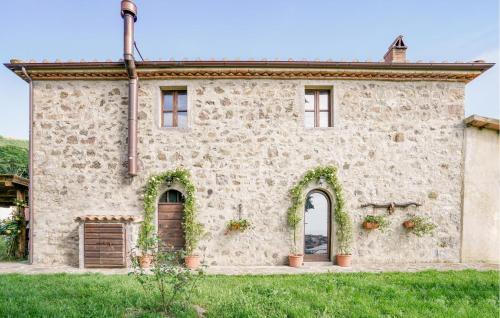 an external view of a stone building with plants at 2 Bedroom Nice Home In Stribugliano in Stribugliano