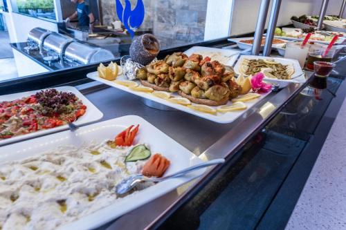 a buffet line with several different types of food at Paloma Family Club in Bitez