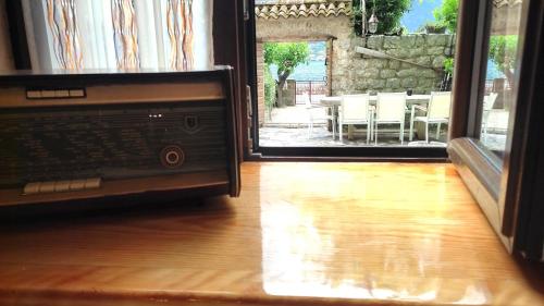 an open door to a patio with a table and chairs at Regina di Dobrota in Kotor
