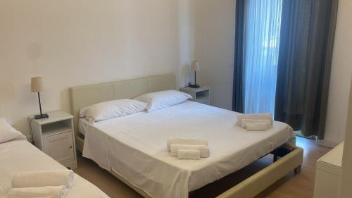 Postel nebo postele na pokoji v ubytování Reggio Centro B&B