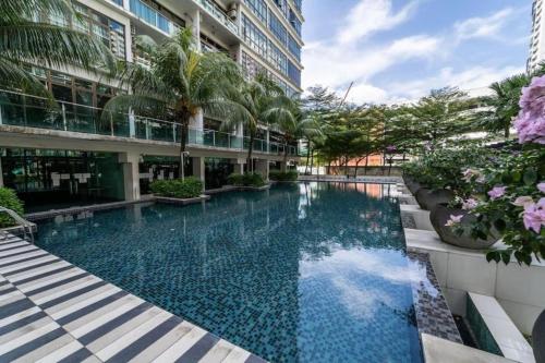 a swimming pool in the middle of a building at 03 Palazio Apartment Japanese style Studio Mount Austin Wifi & Netflix in Johor Bahru