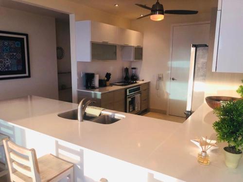 a kitchen with a sink and a counter top at 06F Resort Breathtaking Ocean Views Panama Canal in Panama City