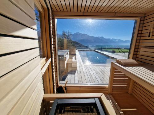 a view from the inside of a sauna with a window at Studio Le Carnotzet Tchiko minimum 2 nights Special weekly and monthly prices in Savièse