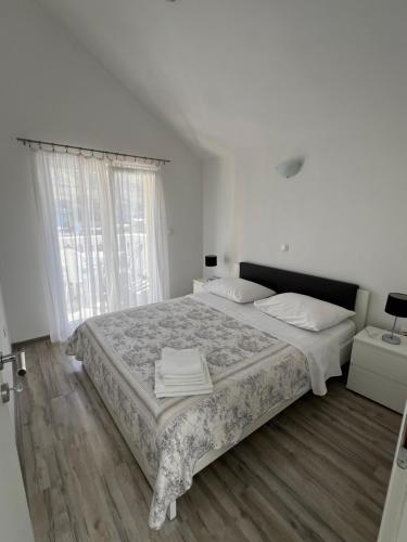 Postel nebo postele na pokoji v ubytování Sunce apartments