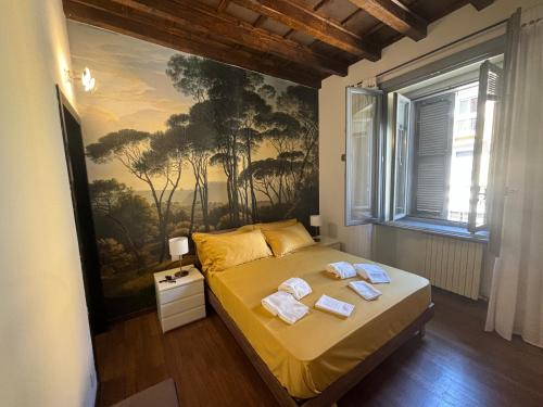 a bedroom with a bed with a painting on the wall at Marghera Botanical - Intero appartamento 50m2 in Milan