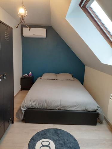 Ένα ή περισσότερα κρεβάτια σε δωμάτιο στο Chambres confortables proche Disneyland Paris