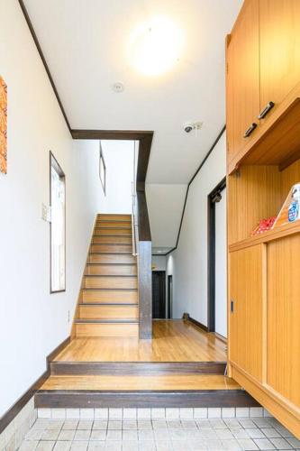 a hallway with a staircase in a house at 青柳館 Aoyagi-Kan in Hakodate