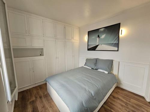 Katil atau katil-katil dalam bilik di Appartement luxe - Colombes