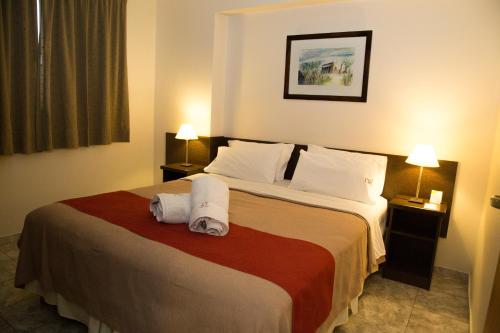 מיטה או מיטות בחדר ב-Vecchia Terra Apart Hotel