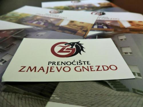 a sign for a z morpacco geneoccioco on a table at B&B Zmajevo Gnezdo 021 in Sremska Kamenica