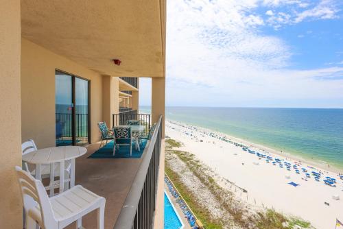 a balcony with a view of the beach at Phoenix V 1403 condo in Orange Beach