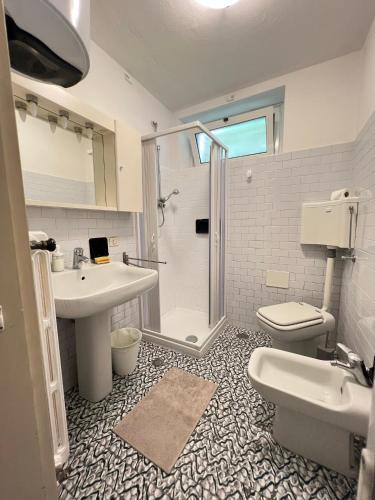 a bathroom with a shower and a sink and a toilet at Alta Valle Intelvi LA MARINELLA in Lanzo dʼIntelvi