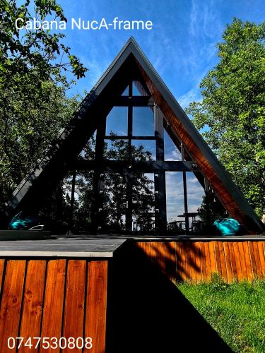 a large wooden bridge with a wooden fence at Cabana NucA-Frame Baia Mare in Satu Nou de Jos