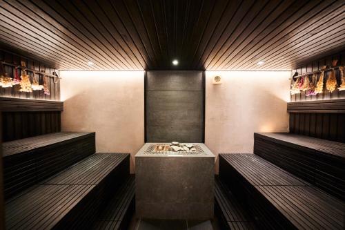 a room with two benches and a table in it at Nouri in Bad Krozingen