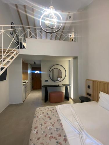 a bedroom with a large bed and a staircase at Villa Diamond in Parga