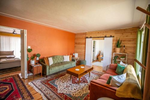 a living room with a couch and a table at Cozy Home with Downtown View in San Diego