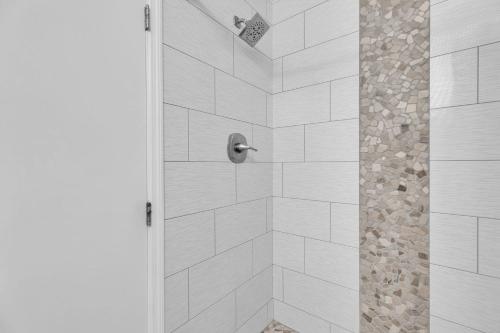 a bathroom with a shower with a glass door at St Thomas - Waterfront Penthouse sleeps 16 w Pool & Boat Dock in Key West