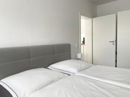 Ένα ή περισσότερα κρεβάτια σε δωμάτιο στο Heide Apartments