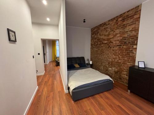 Postel nebo postele na pokoji v ubytování KK Apartament Marszałkowski