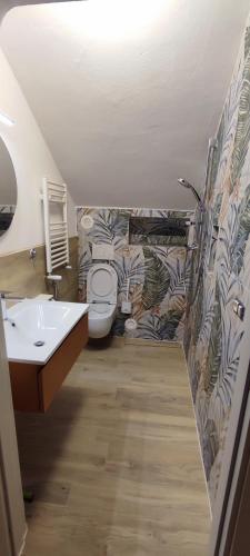 a bathroom with a sink and a toilet at Appartamento di Porta Maggiore in Cupra Marittima