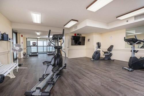 a gym with several exercise bikes in a room at Beachfront Bliss-Phoenix II in Orange Beach