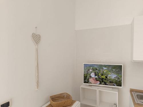 TV a/nebo společenská místnost v ubytování Le Sirene Sweet Home