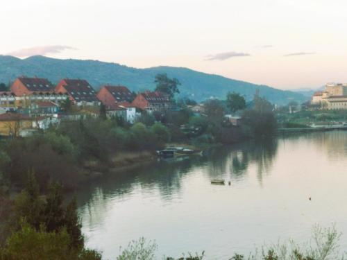 a view of a river with houses and buildings at La Casita de la bahía in Pontejos