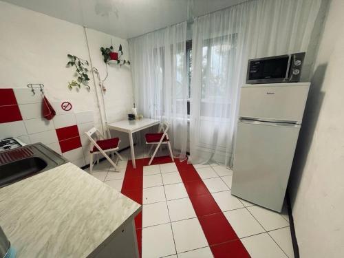 Η κουζίνα ή μικρή κουζίνα στο Apartments on Polytech